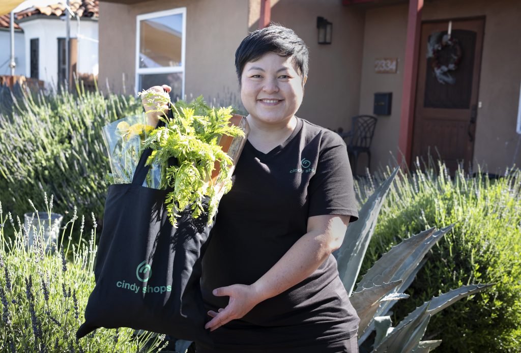 Photo of Cindy Pao delivering groceries