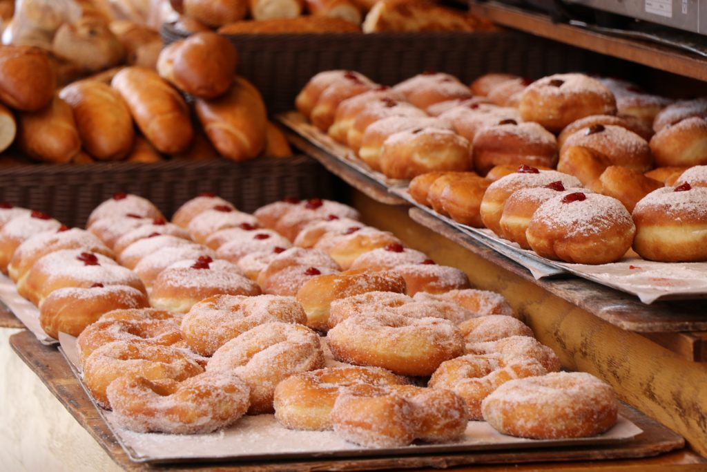 trays of baked doughnuts